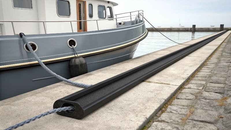 The gunwale of a boat with a protective rub rail installed on it.